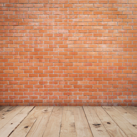Old red brick wall and wood floor background and texture with copy spaceの写真素材