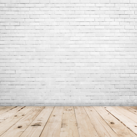 Old white brick wall and wood floor background and texture with copy spaceの写真素材