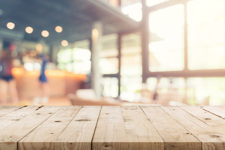 Empty wood table and Blurred background : Customer at coffee shop blur background with bokeh,...