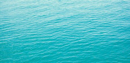 Panorama of clear blue sea with waves backgroundの写真素材