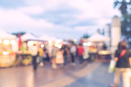Abstract blur background in night market at shopping mall for background, Vintage toned.の写真素材