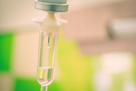 Saline solution drip for treatment patient in the hospital.の写真素材