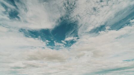 Blue sky and clouds as vintage background with soft focusの写真素材