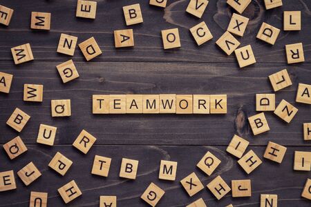 Teamwork wood text and wood block on table for business concept.の写真素材