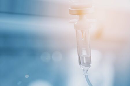 Saline solution drip for treatment patient in the hospital.の写真素材
