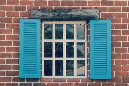 Retro a window with an arch on wooden wallの写真素材