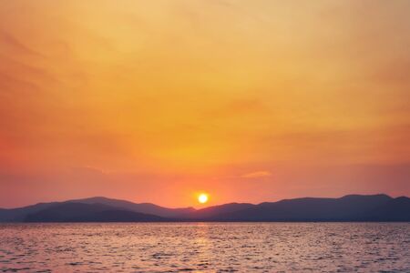 landscape of sunset on the coast sea, waves, horizon. top view.の写真素材