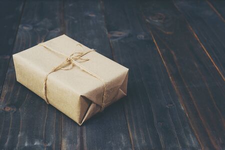  brown gift box on wooden table background with copy space.の写真素材