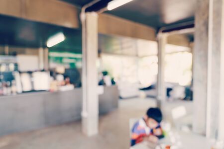 Blur coffee shop or cafe restaurant with bokeh lightの写真素材