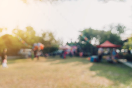 Abstract blur people and sunlight at festival in the city park garden with bokeh background.の写真素材