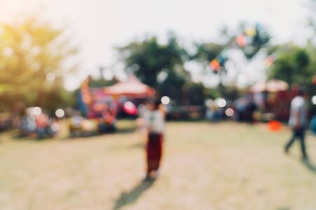 Abstract blur people and sunlight at festival in the city park garden with bokeh background.の写真素材
