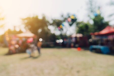 Abstract blur people and sunlight at festival in the city park garden with bokeh background.の写真素材