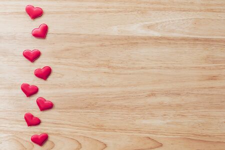 Top view red heart on wood table background with copy space.の写真素材