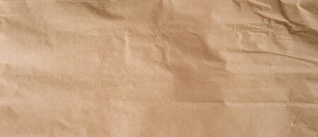 crumpled brown paper background and texture with copy  space.の写真素材