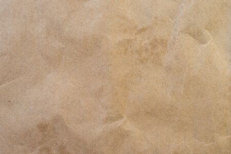 crumpled brown paper background and texture with copy  space.の写真素材