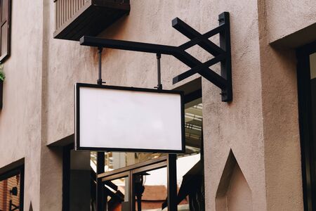 horizontal empty signage on clothes shop front with copy space.の写真素材