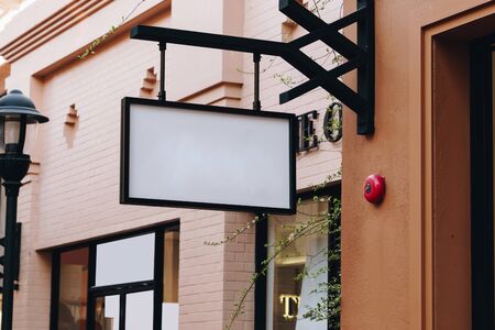 horizontal empty signage on clothes shop front with copy space.の写真素材