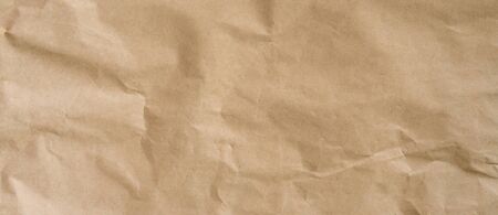 crumpled brown paper background and texture with copy  space.の写真素材