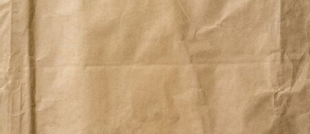 crumpled brown paper background and texture with copy  space.の写真素材
