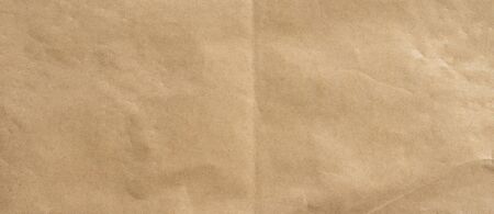 crumpled brown paper background and texture with copy  space.の写真素材