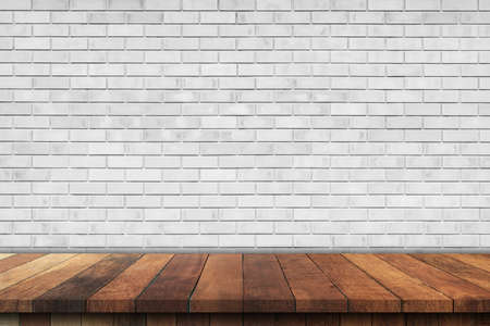 Empty wood table over white brick wall background, product montage display backgroundの写真素材