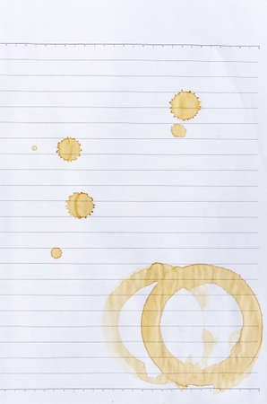 Coffee stains on lined paperの写真素材