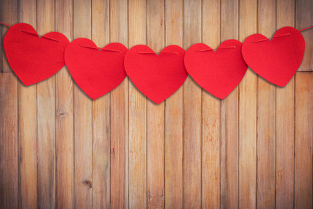 Red heart hanging on Wood Background and Texture vertical.の写真素材
