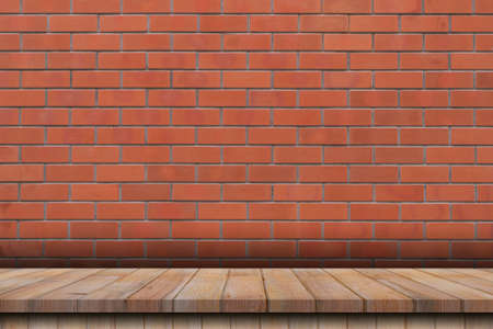 Empty wood table over red brick wall background, product montage display backgroundの写真素材