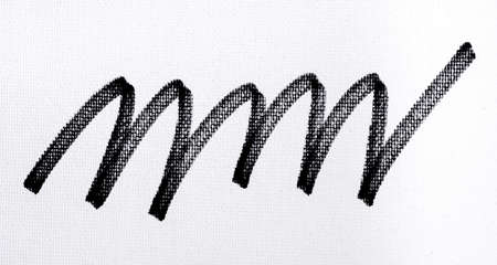 black ink shape on watercolor paper texture backgroundの写真素材