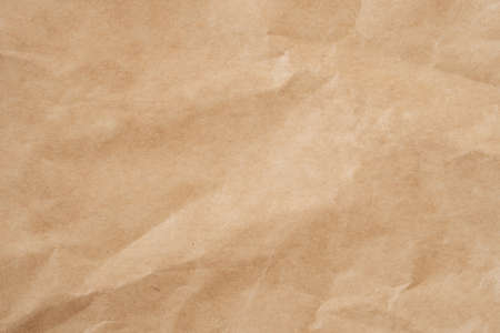 Close up crumpled brown paper texture and background with copy spaceの写真素材