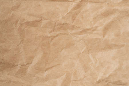 Close up crumpled brown paper texture and background with copy spaceの写真素材