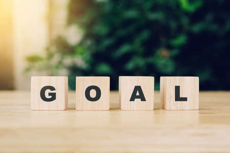 Word GOAL block wood on wooden table background. GOAL Business concept.の写真素材
