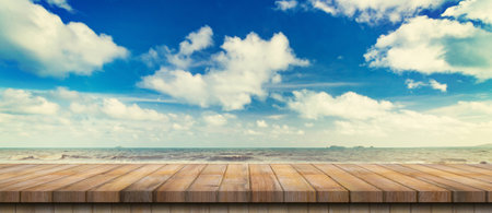 Empty wood table and landscape the coast sea, waves with display montageの写真素材