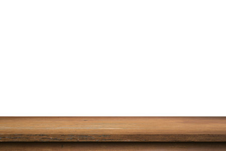 Empty wood table on isolate white background and display montage with copy space for product.の写真素材