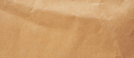 Close up crumpled brown paper texture and background with copy spaceの写真素材