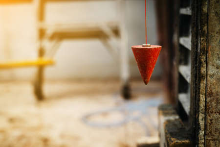 pendulum with plum for finding vertical lineの写真素材