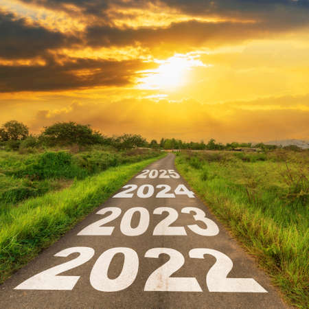 New Year 2022 Goals Concept : Empty asphalt road sunrise with text go to New year 2022の写真素材