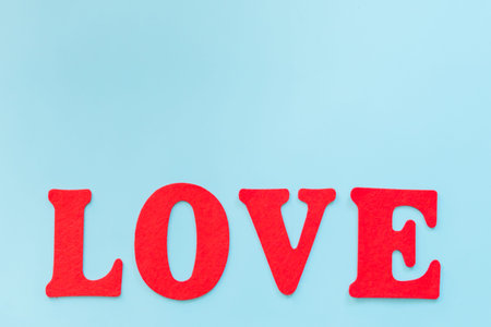 Love text on blue background with copy space