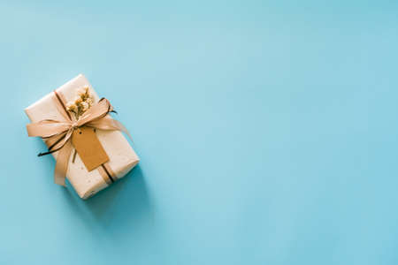 Craft paper gift boxs set on blue background with copy space for text.の写真素材