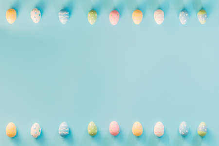 Easter eggs on blue background with copy space for textの写真素材