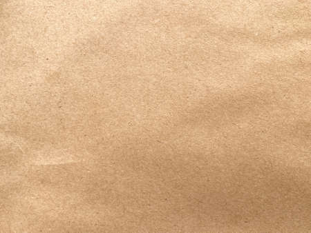 Close up crumpled brown paper texture and background with copy spaceの写真素材