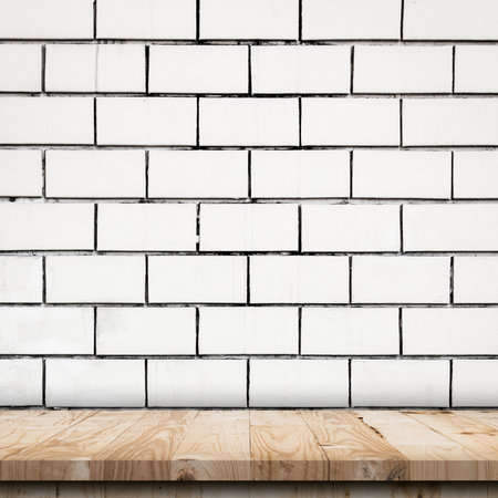 Empty wooden table top and white brick wall and rough crack background textureの写真素材