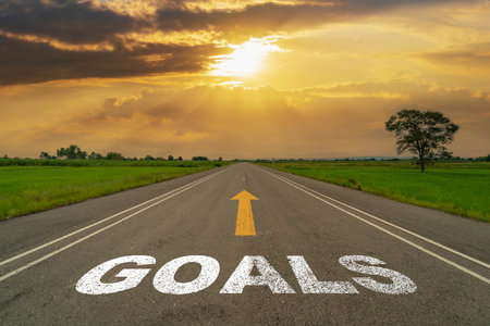 Goals on highway road of empty asphalt road at beautiful sunset.の写真素材