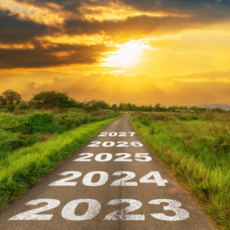Empty asphalt road and New year 2023 concept. Driving on an empty road to 2023 with sunset.の写真素材