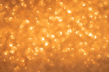 Orange bokeh and defocused background with copy spaceの写真素材