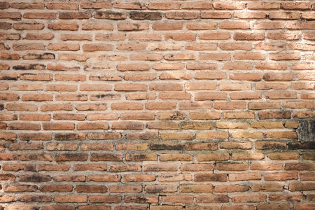 Detail of a brown brick wall texture and background with copy spaceの写真素材