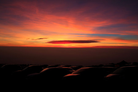 sunset above the carの写真素材