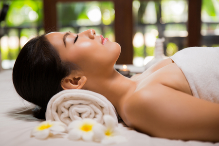 woman having massage and spa salon Beauty treatment concept, She is very happy,top viewの写真素材