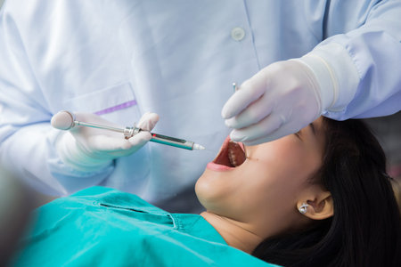 Asian woman gives dentists examined the teeth