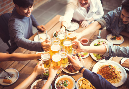 People in asian are celebrating the festival they clink glasses beer and dinner happy.top view